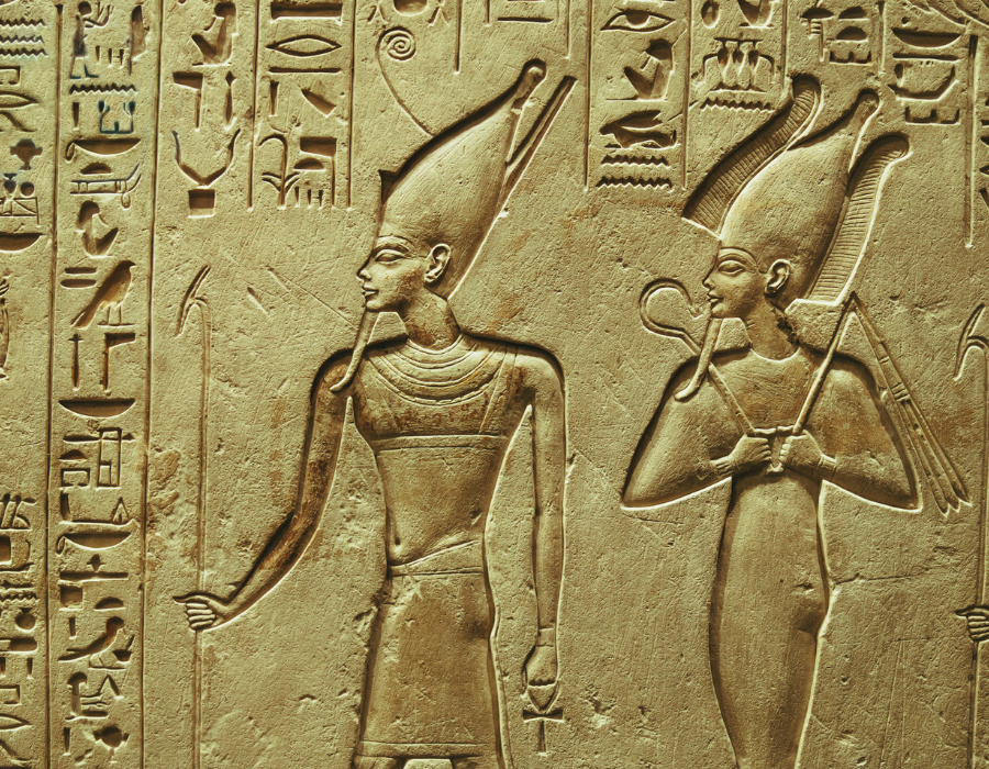 Ancient Egyptian relief of two deities with hieroglyphics